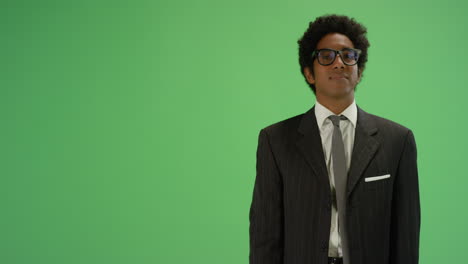 Businessman-gesturing-with-one-arm-on-green-screen